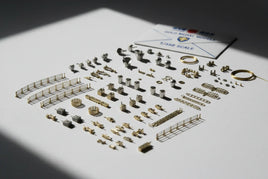 Photo of 1/350 scale ship model brass and metal accessories set, organized on white surface