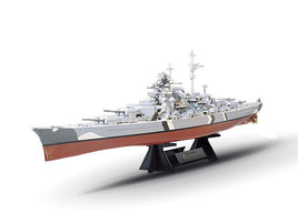 Detailed gray and red scale model of the Bismarck battleship on black display stand