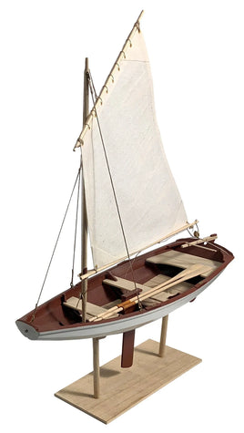 Detailed miniature wooden sailboat model with white sail on wooden stand, handcrafted nautical decor