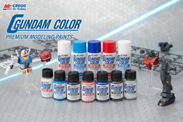 Gundam Color premium modeling paints by Mr. Hobby displayed with Gundam model parts on tabletop