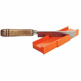 Hand saw with wooden handle placed on orange plastic miter box for precise cuts