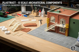 O scale model building kit with architectural components, tools, and accessories on workbench at MPM Hobbies