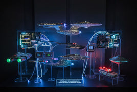 Illuminated sci-fi model display with starships, circuit boards, fiber optic lighting, and control panels.