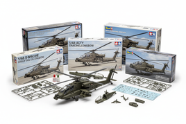 Professional display of 1/48 scale military helicopter model kits including Apache attack helicopters and utility helicopters arranged on white surface with studio lighting showing detailed plastic model kit boxes