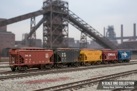 N Scale ore hopper cars on tracks featuring Bachmann models in DM&IR mineral red, Pennsylvania tuscan, and other classic liveries with weathered industrial details