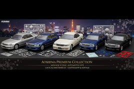 Aoshima Premium Collection 1/24 Japanese car model kits displayed with parts, Tokyo cityscape in background