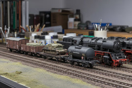 Scale model train set with detailed tank cars and steam locomotive on display at MPM Hobbies