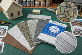 Assorted JTP Plastics O scale textured plastic sheets for model building on a hobby desk
