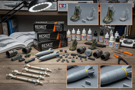 Airplane model kit parts, 3D printed accessories, paints, and tools on workbench at MPM Hobbies