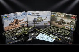 Helicopter plastic scale model kits and parts from Revell, ICM, and Special Hobby on display