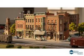HO scale Design Preservation Models downtown buildings featuring detailed storefronts, commercial structures, and modular kits with brick textures