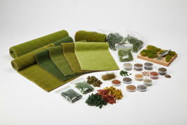 Assorted model scenery grass mats, bushes, flocking, and foliage for diorama and hobby crafts from MPM Hobbies
