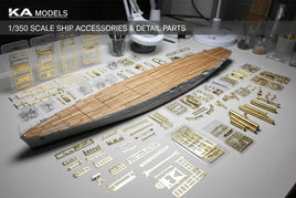 1/350 scale model ship kit with brass accessories and detail parts on hobby workspace