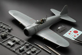 Model airplane kit with tools, decals, and assembled parts on dark surface from MPM Hobbies