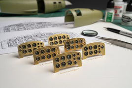 Assorted 3D printed model airplane cockpit dashboards on a workbench at MPM Hobbies shop