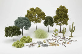 Assorted model trees, cacti, bushes, twigs, and rocks for diorama or 3D printed hobby scenery