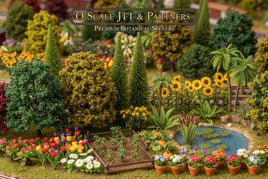O scale model scenery with detailed miniature trees, flowers, garden, pond, and sunflowers