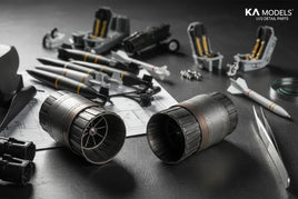 1/72 scale jet model parts, jet nozzles, rockets, seats, and tools on a workbench, KA Models