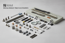 Professional display of N scale model railroad track accessories including rerailers, track nails, bumping posts, cleaning tools, and layout tables from Atlas, KATO, Bachmann, and Woodland Scenics brands
