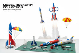 Model rocket kits and parts on a cutting mat with launched rockets and parachutes, MPM Hobbies model rocketry collection.