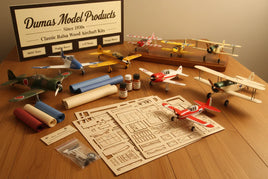 Dumas Model Products balsa wood aircraft kits, model planes, supplies, and assembly parts on table