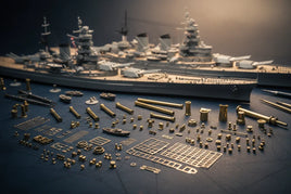Detailed model battleship kit with brass parts and tools on a table, MPM Hobbies product