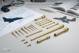 Brass model airplane parts on desk with aircraft blueprint, tools, and MPM Hobbies branding