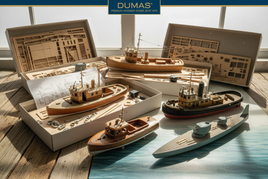 Premium wooden model boat kits with assembly parts and instructions, displayed in sunlight, MPM Hobbies