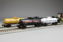 N scale tank cars in multiple liveries including Union Pacific, Canadian National, and chemical company markings on railroad tracks