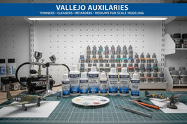 Vallejo auxiliaries paints, thinners, and airbrush tools for scale modeling on hobby workbench at MPM Hobbies