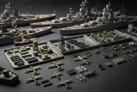 3D printed model ships, planes, and military accessories from MPM Hobbies displayed on a tabletop