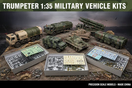 Trumpeter 1:35 military vehicle model kits with assembled trucks, tanks, and kit box contents