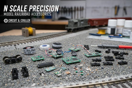 N scale model railroad accessories and electronics on a train layout workbench at MPM Hobbies