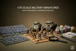 1/76 scale WWII military miniatures with painted soldiers, tanks, model sprues, and hobby paint supplies