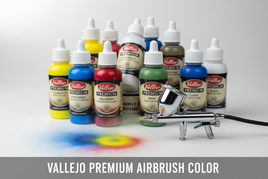 Vallejo Premium airbrush paints in assorted colors with an airbrush tool on white surface.