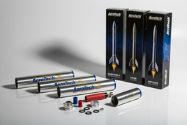 AeroTech model rocket motors reload kits RMS systems mid-power rocket components arranged on white surface showing precision engineering quality craftsmanship