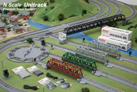 N scale Unitrack model railroad setup with bridges, tracks, and Kato train accessories from MPM Hobbies.