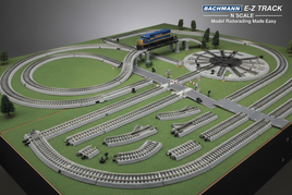 N scale Bachmann E-Z Track model railroad set with tracks, train, bridge, and turntable on green base