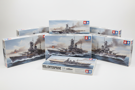Tamiya 1/350 scale WWII warship model kit boxes featuring Yamato, Bismarck, Missouri battleships and Enterprise carrier
