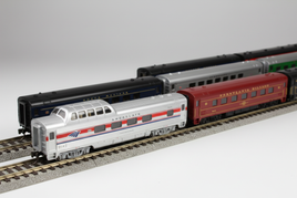 Detailed HO scale passenger cars including Amtrak coaches, PRR dining cars, and observation cars on model railroad track