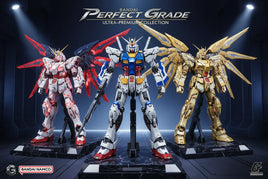 Three Bandai Perfect Grade Gundam model kits with detailed armor, wings, and vivid colors on display.
