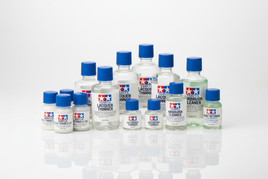Tamiya model paint thinners and airbrush cleaner bottles with blue caps, sold at MPM Hobbies