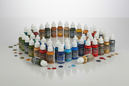 Vallejo model paints set with colorful bottles arranged in a semicircle, ideal for hobby painting.