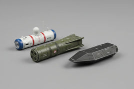 Three detailed scale model aircraft pods in white, green, and black on a gray background