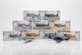Tamiya 1/72 scale WWII propeller aircraft model kit boxes featuring P-51 Mustang, Spitfire, Zero Fighter, Bf109, and Corsair