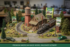 Detailed model railroad town scene with train, rural buildings, cars, trees, and Woodland Scenics products
