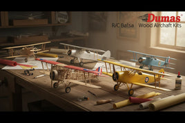 Dumas RC balsa wood model aircraft kits on a hobby workbench at MPM Hobbies