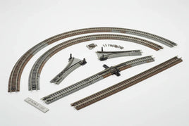 Z scale model train track set with curved, straight, and switch tracks on white background