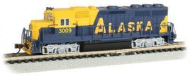 N-scale model locomotive with Alaska Railroad blue and yellow paint on model train track