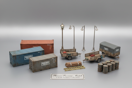 O scale Phoenix Precision Models scenery accessories including industrial containers, utility trailers, street lights, ladders, lumber stacks and drums for model railroad layouts